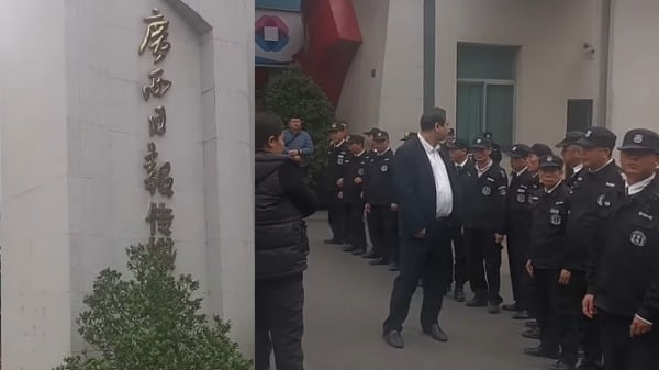 12月10日,民工围堵中共党媒《广西日报》报社讨薪,被保安阻挡。